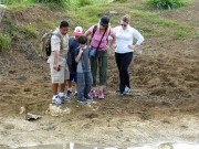 Naturalist guide, Ruben Arevalo, points out fresh wildcat paw prints.